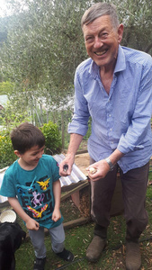 Grandad and grandson with day old chickens